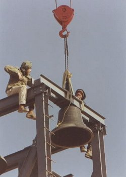 Soma and Gaurashakti install the bells.