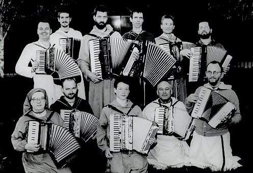 11 robed accordionists
