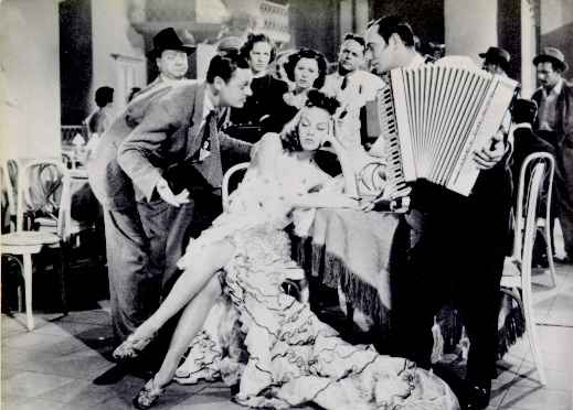 Jerome Cowan, Vera Zorina, and Phil Baker in a scene from the 1938 film The Goldwyn Follies, with music by George Gershwin.