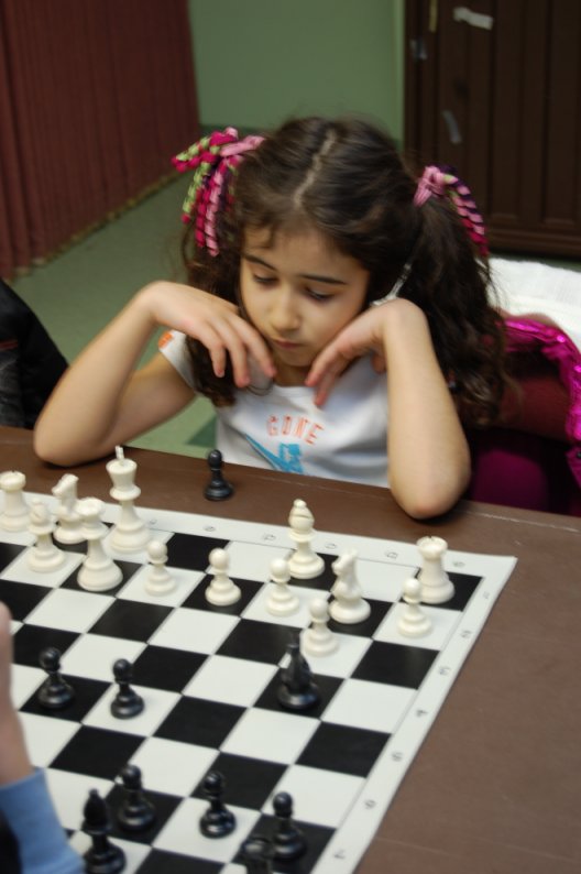 Alya Dusmez, 6, contemplates her next move.