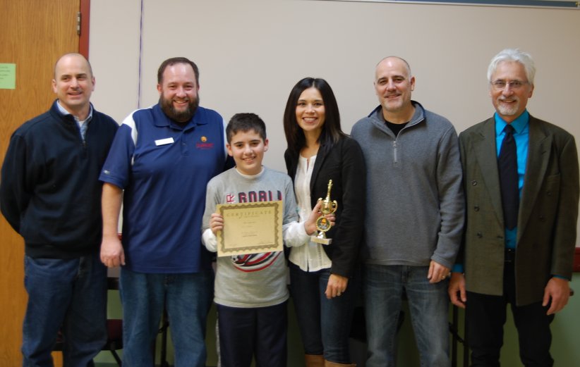 First Place Winner Luke Choban, Mrs. Choban, Mr. Choban, and Chess4Kidz Instructor Henry Doktorski.